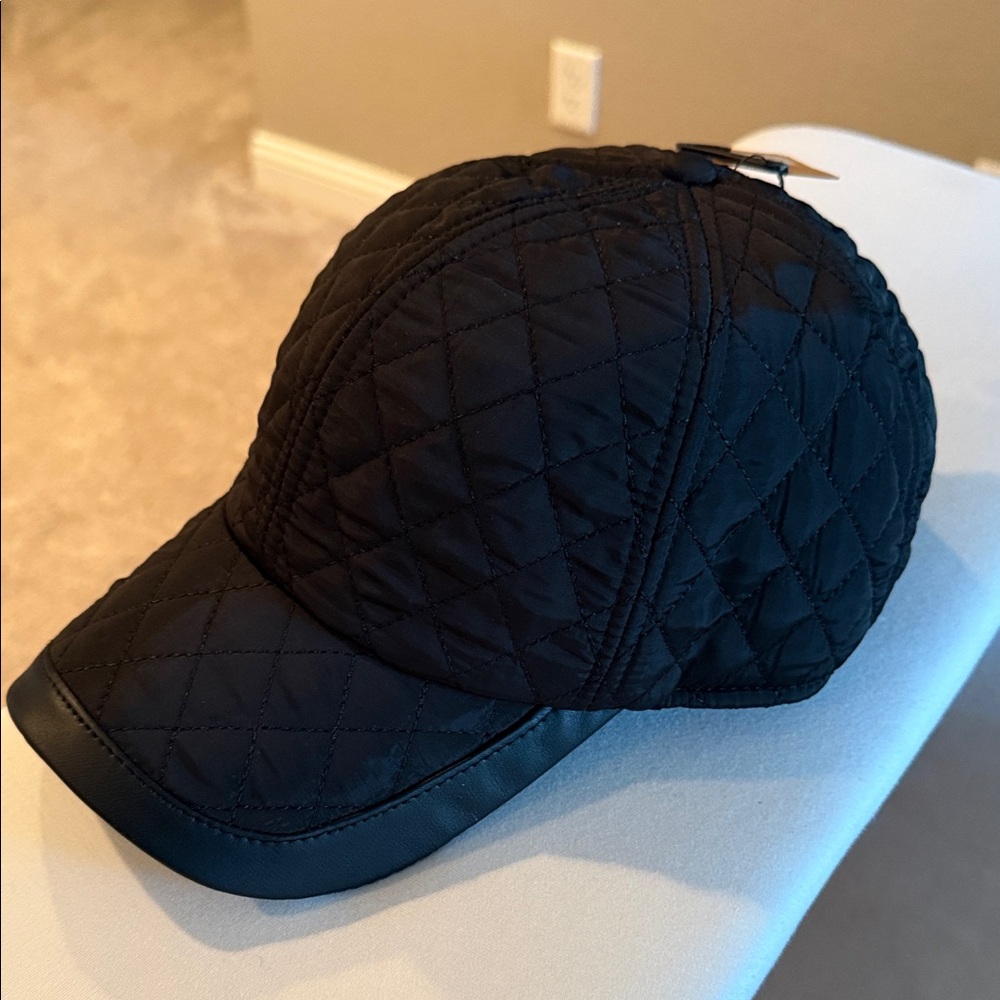New with tags Go & Go quilted hat w ear flaps 
Adjustable back